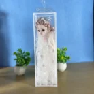 Collection of miniature dolls with designer gowns and musical ability, perfect for gifting